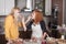 Girlfriends feeding each other in the kitchen