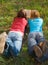 Girlfriends read book lying down