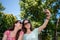 Girlfriends taking selfie together having fun outdoors concept of modern women friendship lifestyle female best friends happy