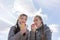 Girlfrinds with appetite bites off red apple sitting on bench