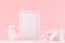 Girlish gentle Valentine days mockup - soft pastel pink heart with ribbon, bow and blank frame on white wooden background.