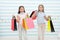 Girlish happiness. Kids happy carry bunch packages. Shopping with best friend concept. Girls like shopping. Kids happy