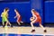 Girls athlete in sport uniform playing basketball