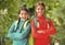 Girls backpackers friends fleece clothes backpacks forest background, mountaineering concept