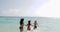 Girls In Bikini Running In Water Holding Hands On Beach Back Rear View, Cheerful Women Group Tourists On Summer Holiday