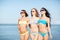 Girls in bikini walking on the beach