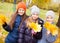 Girls and boy at autumn