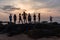 Girls Boys Silhouetted Beach Ocean Sunrise