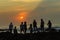 Girls Boys Silhouetted Beach Sunrise Ocean