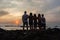 Girls Boys Silhouetted Beach Sunrise Ocean