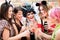Girls at Carnival parade clinking glasses with champagne