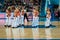 Girls cheerleading appear on basketball parquet