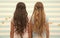 Girls children long curly hair rear view. Treat hair proper way according type. Apply conditioner mask after washing and