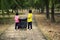 The girls collected plastic bottles of garbage into black bags at the park.