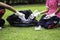 The girls collected plastic bottles of garbage into black bags at the park.