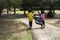 The girls collected plastic bottles of garbage into black bags at the park.