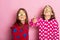 Girls in colorful bright pajamas show thumbs up