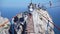 Girls crossing the chasm on the rope bridge. Black sea background, Crimea