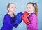 Girls cute boxers on blue background. Friendship as battle and competition. Pass boxing challenge. Test for fortitude