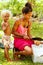 Girls cutting coconut in Lavena village on Taveuni Island, Fiji.