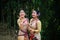 Girls in dance move isolated dressed in traditional wearing on festival with blurred background