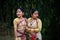 Girls in dance move isolated dressed in traditional wearing on festival with blurred background