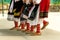 Girls dancing folk dance. People in traditional costumes dance Bulgarian folk dances. Close-up of female legs with traditional