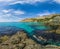 Girls dive on Baunty beach, cape Fiolent in Sevastopol, Crimea on a background of rocky shores. The concept of an travel, relax,