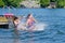 Girls dive bombing friend off dock into lake