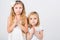 Girls dressed in white palms folded in prayer