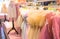Girls` dresses are hung on shelves in children`s clothing stores. Lovely dresses for girls on birthdays, holiday, competitions,..