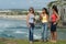 Girls drinking chimarrÃ£o on Torres beach in southern Brazil.