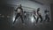 Girls enjoying hip hop moves in dark studio with smoke. Happy dancing women.