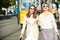 Girls with expressing positive emotions walking on the city street. Travelling in europe, budapest city.