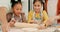 Girls, family and roll dough for cooking, learning and having fun together while bonding. Kitchen, sprinkle flour and