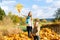 Girls fly an kite in fall or autumn park having fun