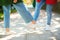 Girls greeting with feet outdoors. Friends on a walk during coronavirus epidemic. Covid-19 concept. Coronavirus prevention