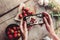 Girls hands taking photo of breakfast with strawberries by smartphone.