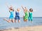 Girls jumping on the beach