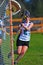 Girls Lacrosse player moves in for a shot