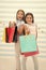 Girls like shopping. Kids happy small girls hold shopping bags. Enjoy shopping with best friend or sister. Girlish