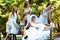 Girls look far away while resting on the bench in park