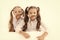 Girls make mustache with long hair white background. Hairstyle concept. Schoolgirls having fun with mustache hairstyle
