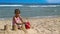 Girls making sandcastles on beach