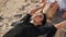 Girls meditate lying on the sand