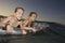 Girls Paddling Out To Sea On Air Mattress