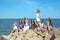 The girls` party on the beach. Eight young women near the sea