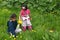 Girls picking up flowers