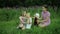 Girls play with dolls on grass