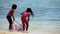 Girls playing on a beach.